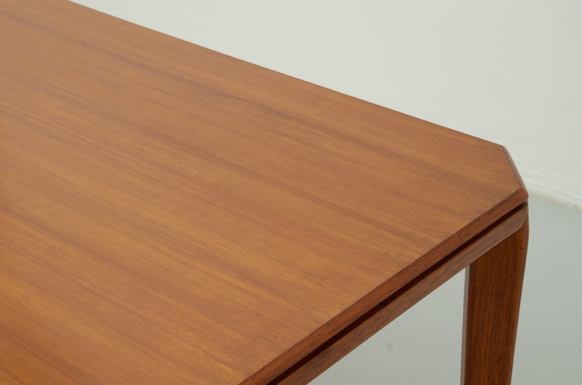 Gio Ponti, two tables in blond walnut with brass crosspiece designed and produced for the BNL offices in Milan in 1956ca.