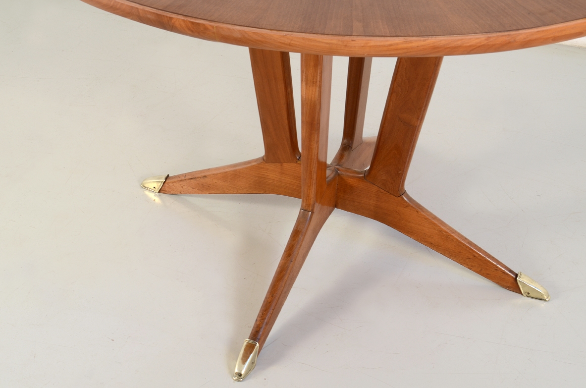 Elegant Italian 1950's table in cherry wood with bronze tips.