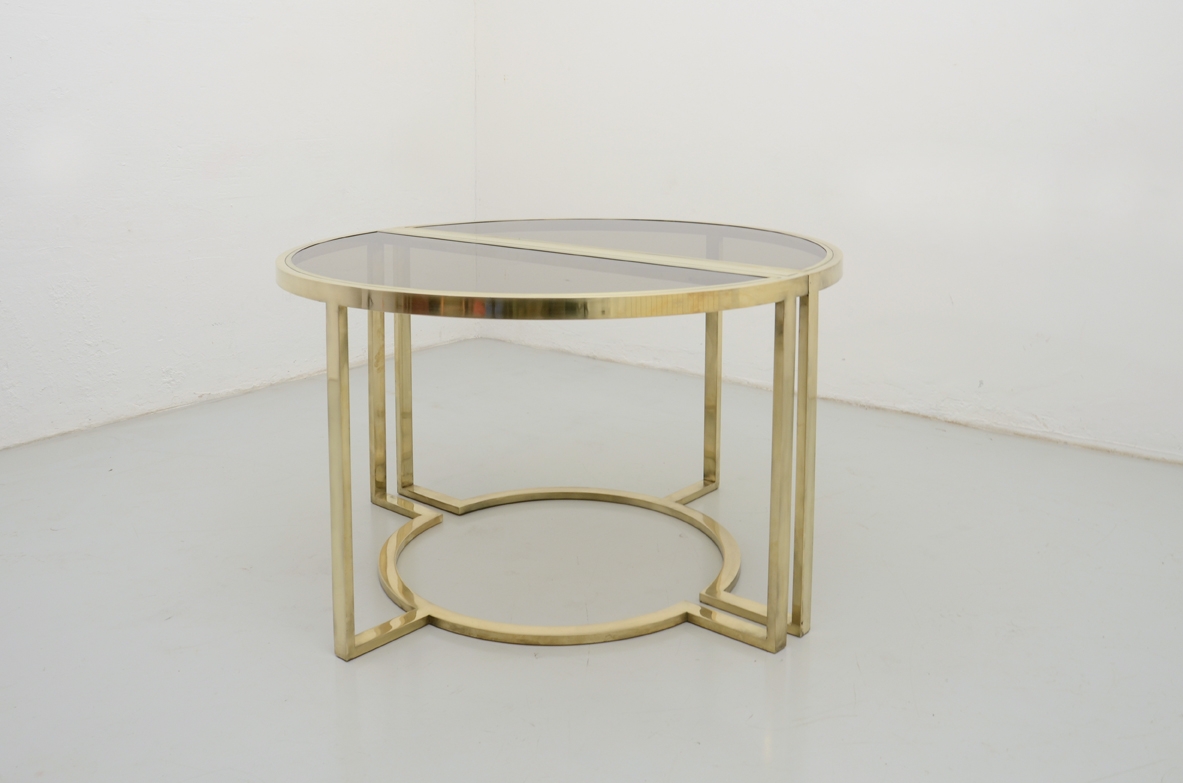 Romeo Rega, tavolo da pranzo in ottone con piano in cristallo brunito, 1970ca. Il tavolo può diventare un tondo oppure una coppia di belle console.
