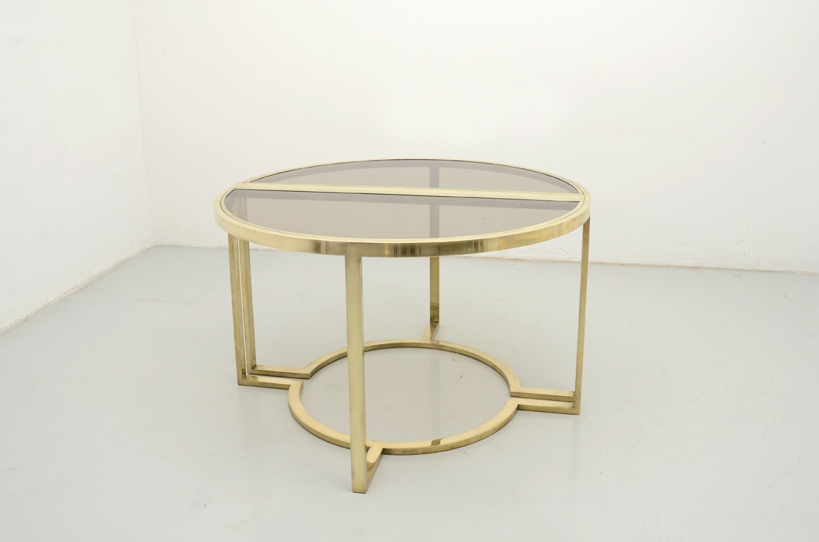 Romeo Rega, tavolo da pranzo in ottone con piano in cristallo brunito, 1970ca. Il tavolo può diventare un tondo oppure una coppia di belle console.