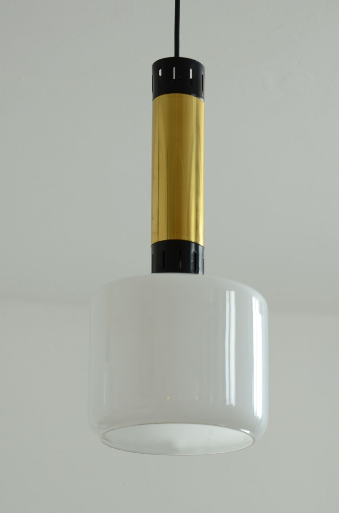 Three elegant 1960’s Stilnovo ceiling lamps in brass and polished metal with a nice and big opal glass shade.  Prod. Stilnovo, Milano.