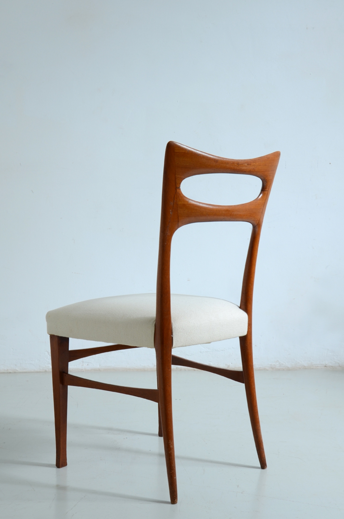 Elegant group of six cherry wood chairs with upholstered seat.