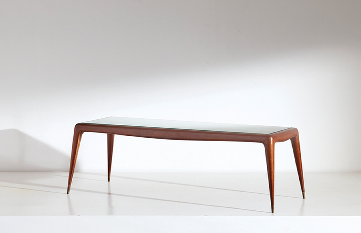 Italian 1930's  coffee table with six brass legs and with allegorical inlay on  top.