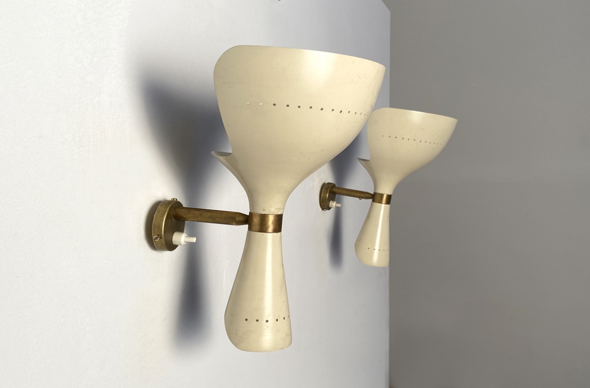 Pair of wall lamps in lacquered metal and brass.  Prod. Lumen 1955.