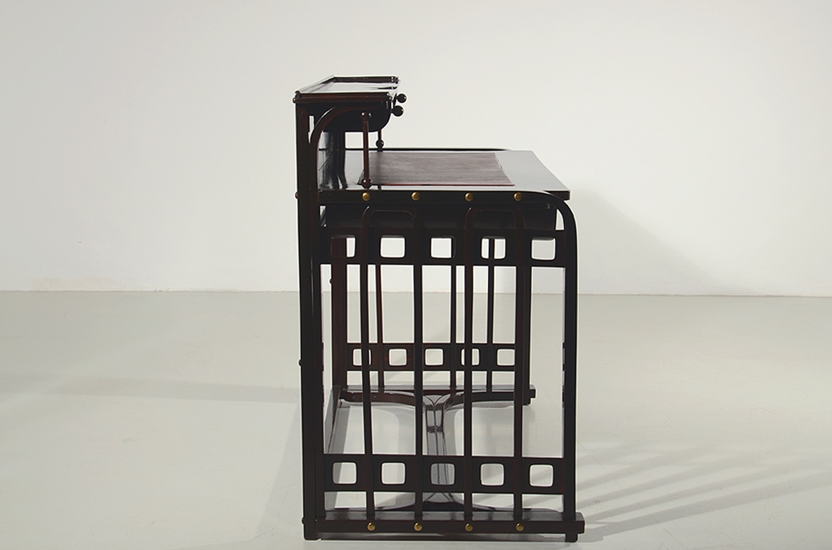 Josef Hoffman, rare desk designed in 1905 ca. and manufactured by J.& J. Khon, Vienna. Beech stained to simulate mahogany, top with a dark red leather, brass handle and details. Lit.: Kohn factory catalogue, 1906, p. 58.  