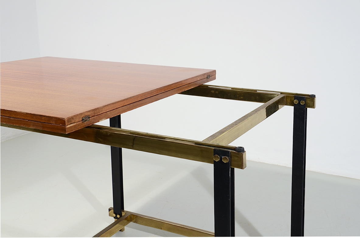 1960s extendable mahogany table with metal and brass structure.