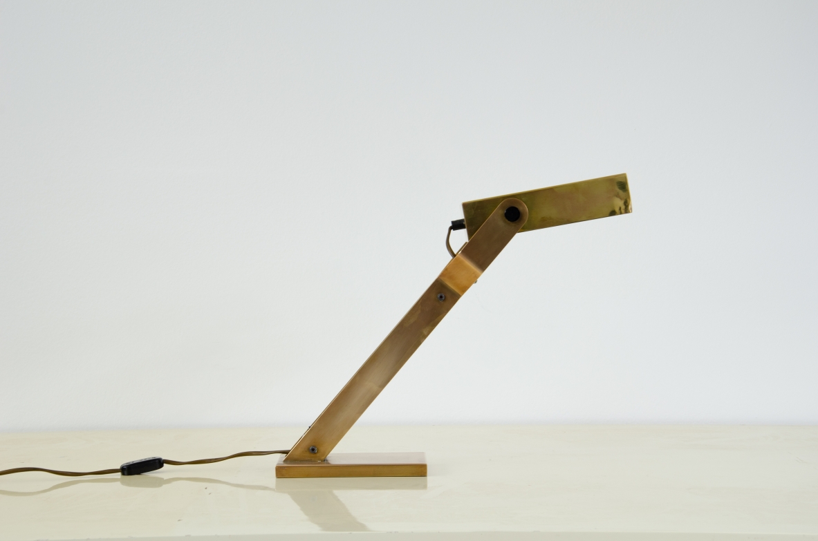 Italian 1960's table lamp in brass with adjustable shade.