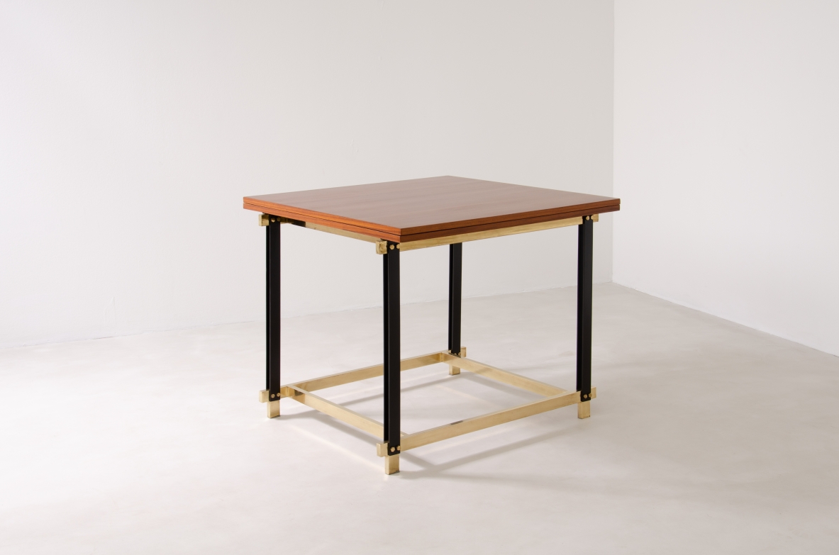 1960s extendable mahogany table with metal and brass structure.