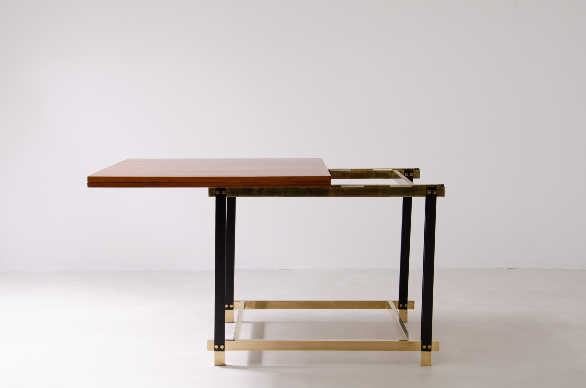 1960s extendable mahogany table with metal and brass structure.