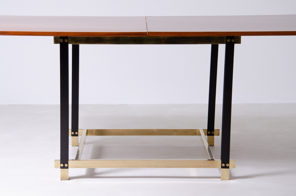 1960s extendable mahogany table with metal and brass structure.
