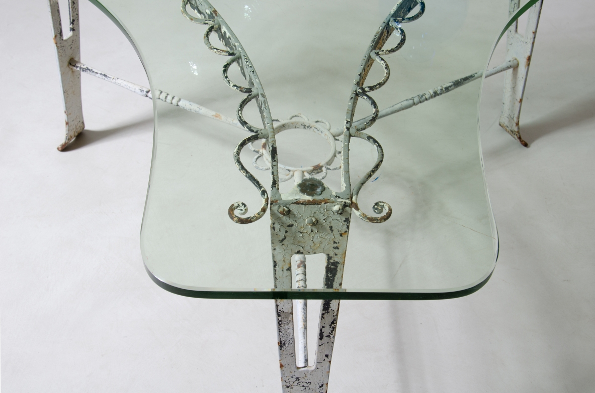 Luigi Brusotti (1877-1959)  Low table in wrought iron with thick shaped glass top.  Milan, 1950s.