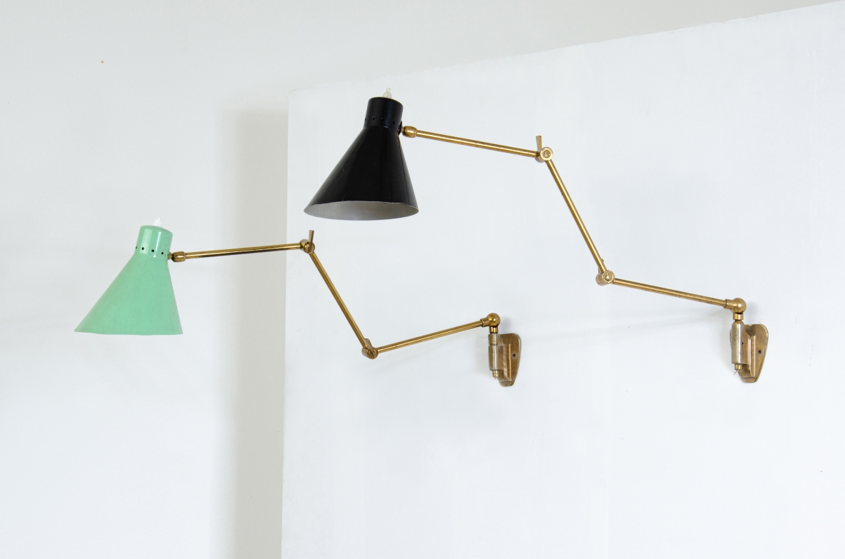 Pair of wall lamps with articulated brass arms and lacquered metal cones.  Italian manufacture 1950s.