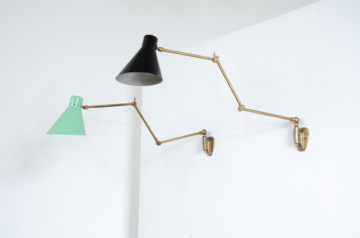 Pair of wall lamps with articulated brass arms and lacquered metal cones.  Italian manufacture 1950s.