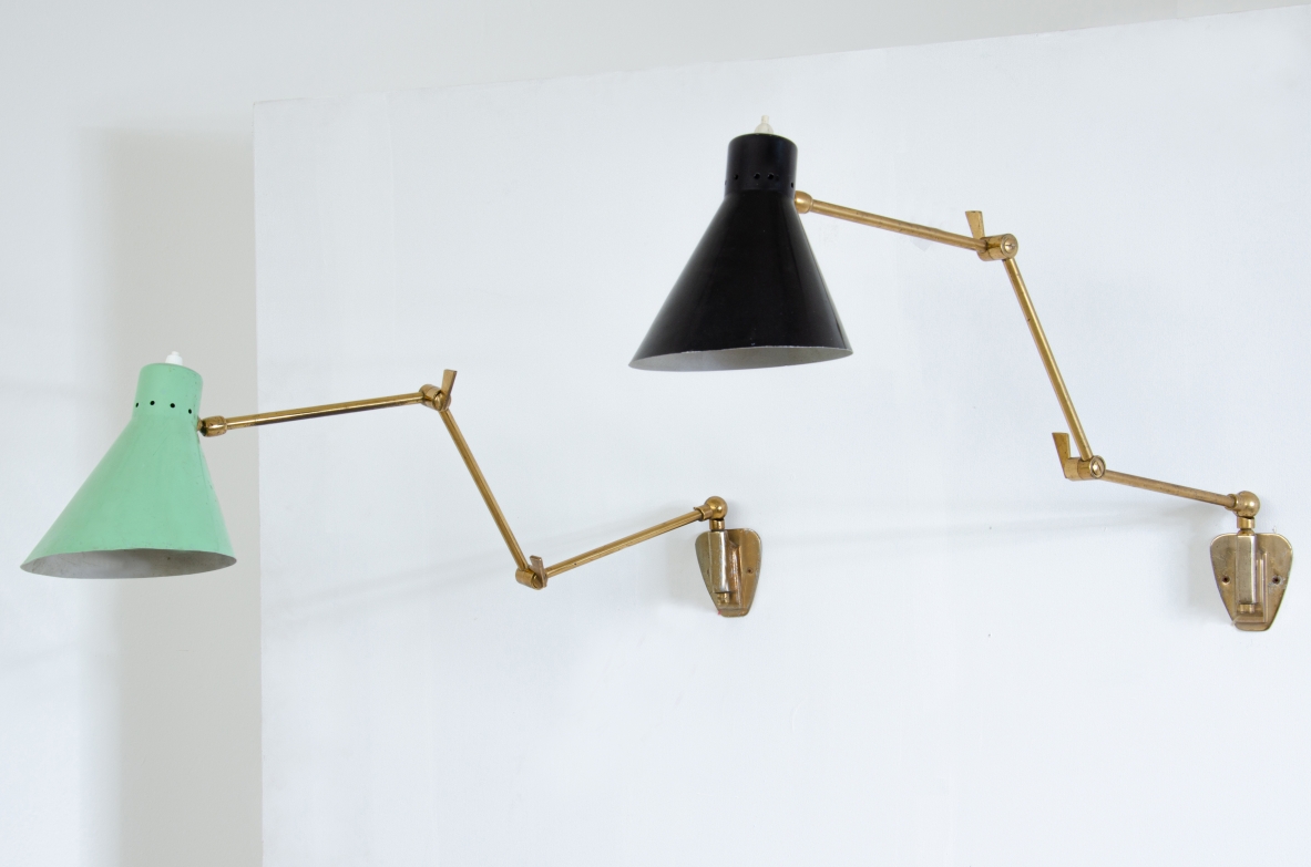 Pair of wall lamps with articulated brass arms and lacquered metal cones.  Italian manufacture 1950s.