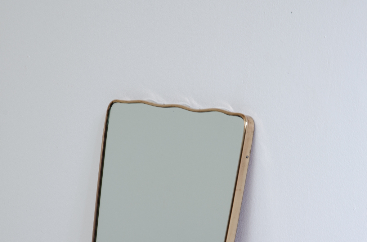 Mirror with wavy brass frame, 1950s.