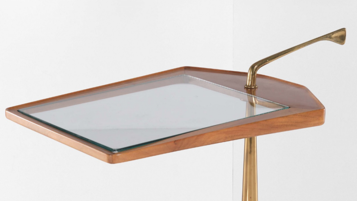 Service table on wheels with two wooden and glass tops. Side upright in shaped brass.  Italian manufacture from the 1950s.