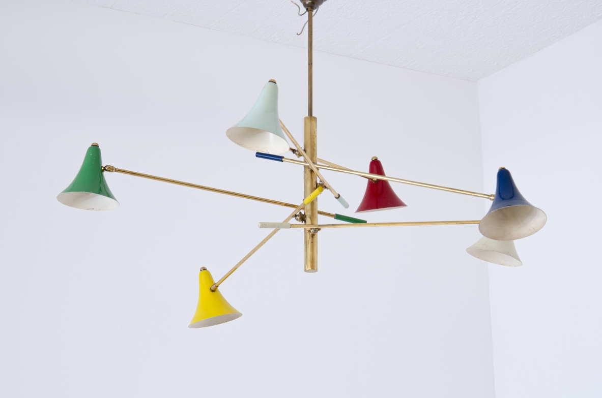 Rare suspension lamp with six adjustable brass arms and painted metal diffusers.  Italian manufacture, 1950s.