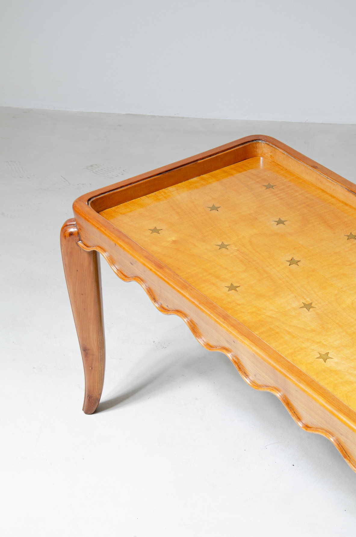 Paolo Buffa, rare 1940's coffee table in maple wood with star inlays in brass, iconic of his most refined pieces.