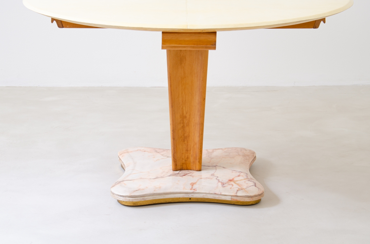 Rare Italian 1950's round table with parchment top, four drawers and marble base.