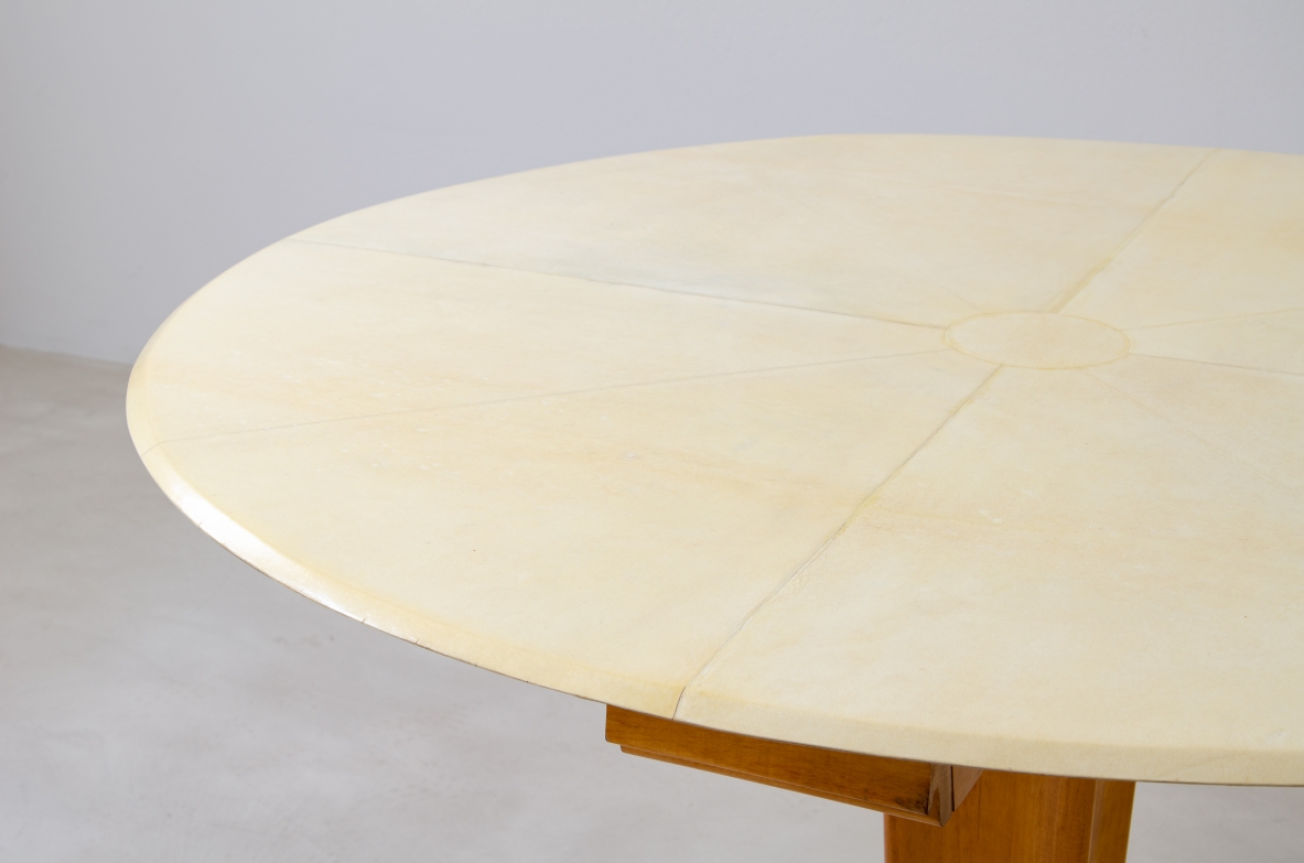 Rare Italian 1950's round table with parchment top, four drawers and marble base.