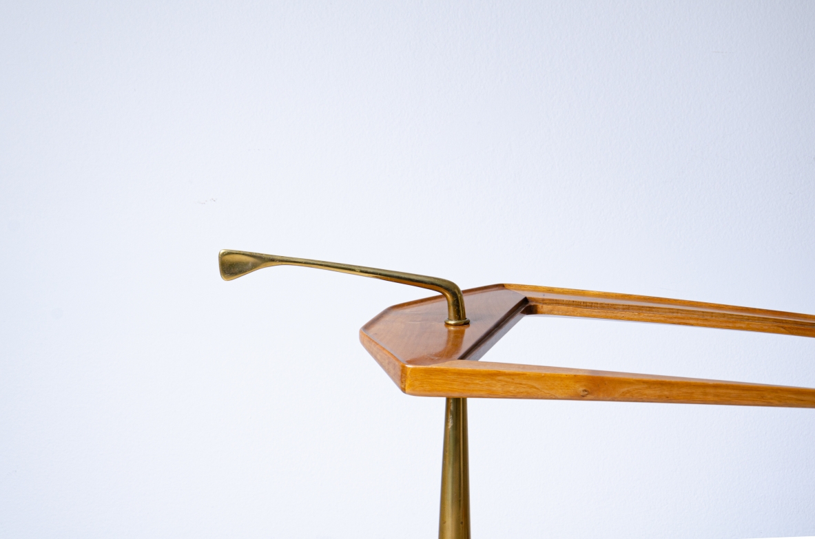 Service table on wheels with two wooden and glass tops. Side upright in shaped brass.  Italian manufacture from the 1950s.