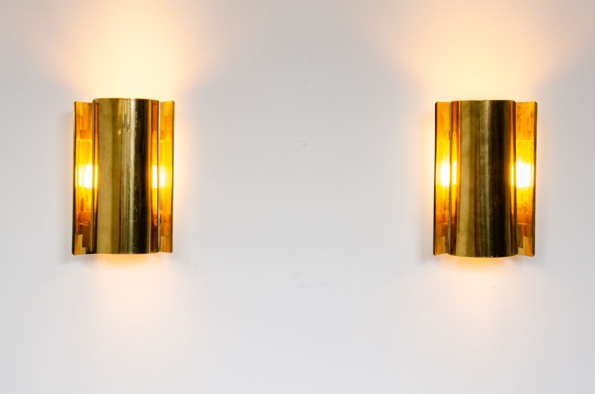 Pair of sconce wall lights in curved brass.  Prod. Falkenbergs, Sweden 1960's.