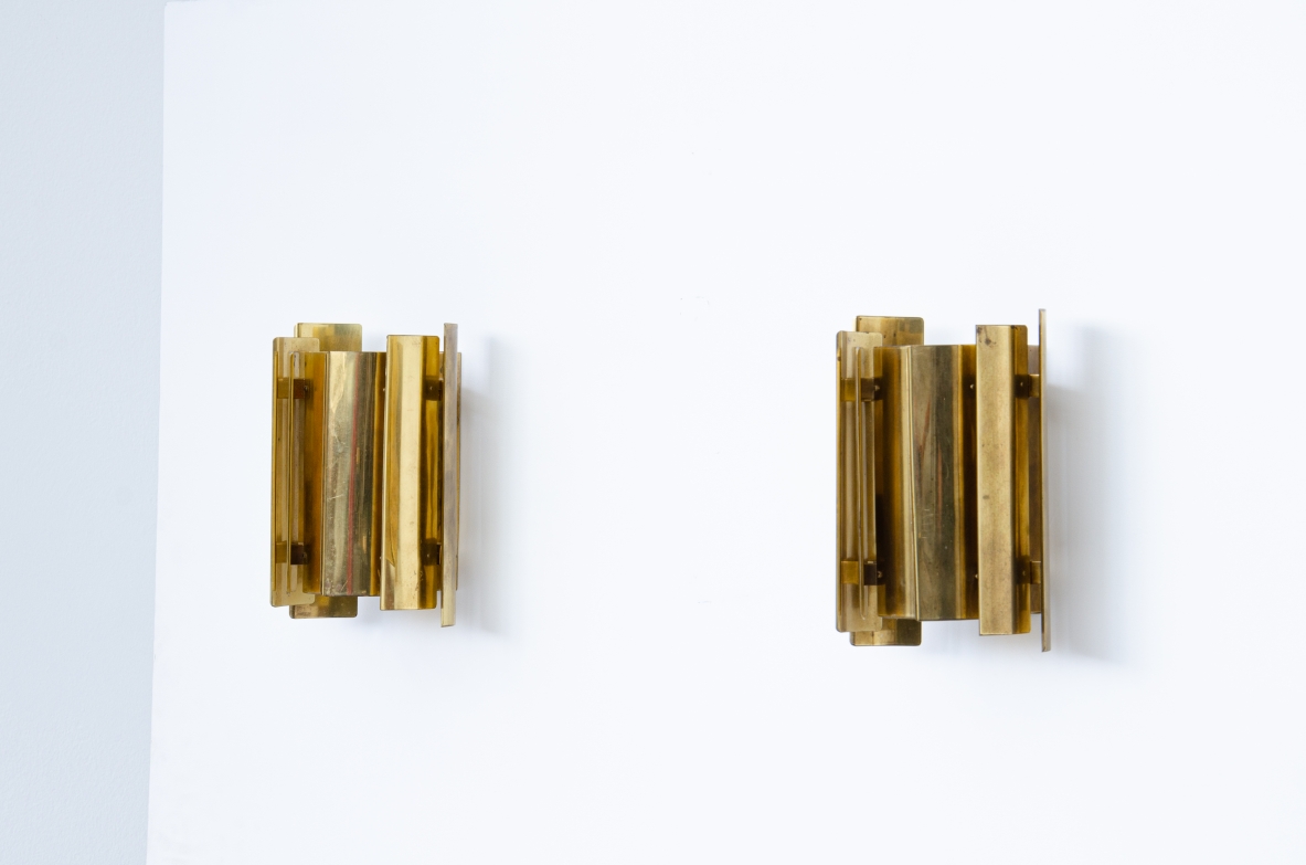 Pair of Scandinavian wall lights in curved brass.  Prod. Falknbergs, Sweden 1960's.