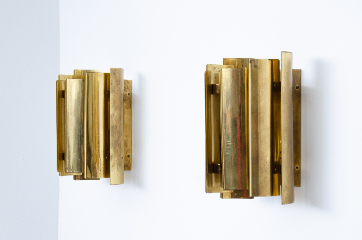 Pair of Scandinavian wall lights in curved brass.  Prod. Falknbergs, Sweden 1960's.