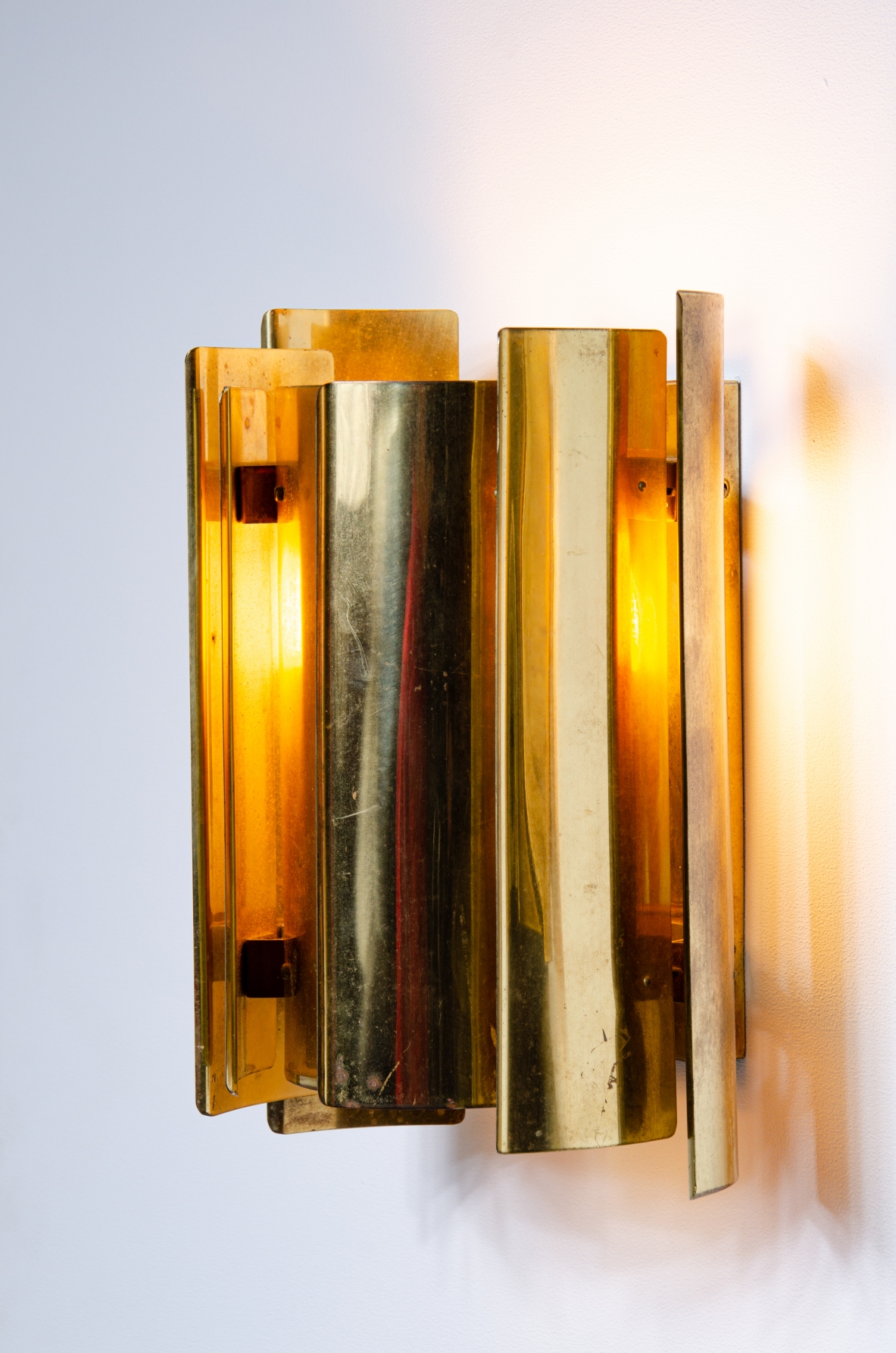 Pair of Scandinavian wall lights in curved brass.  Prod. Falknbergs, Sweden 1960's.