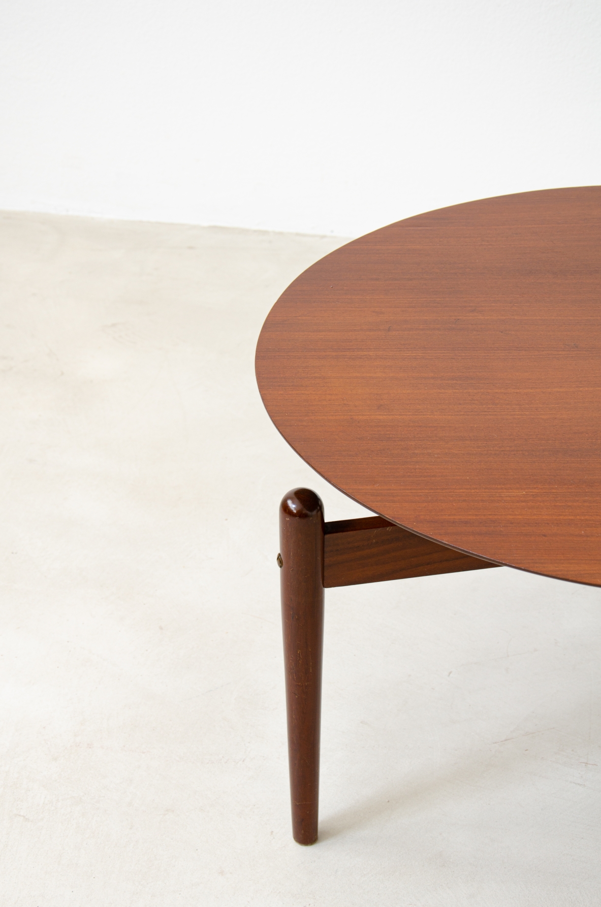 Teak coffee table with three legs held by a structure with crossed spokes and suspended top.  1960's Italian manufacture.