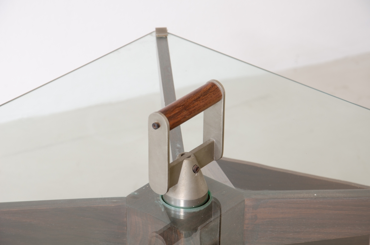 Ico Parisi (1916-1996)  Low table in walnut with swivel shaped structure and swivel glass top with steel and wood handle.1958