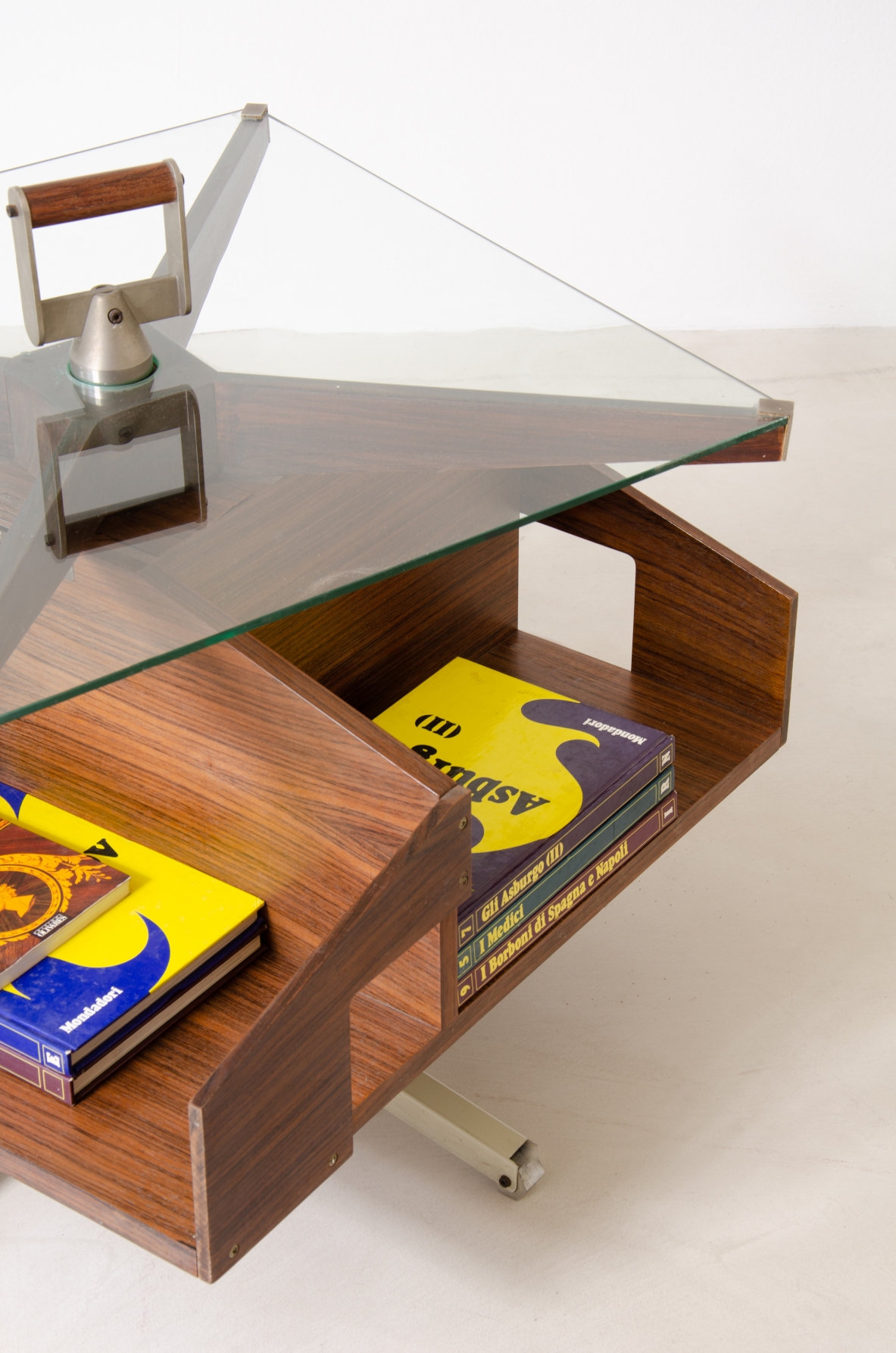 Ico Parisi (1916-1996)  Low table in walnut with swivel shaped structure and swivel glass top with steel and wood handle.1958