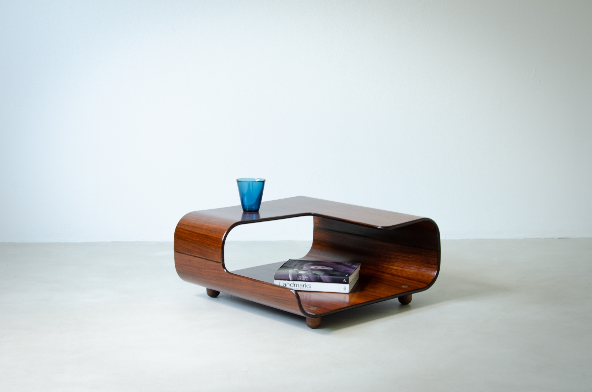 Coffee table in curved wood with two shaped shelves.  Italian manufacture, 1960's.