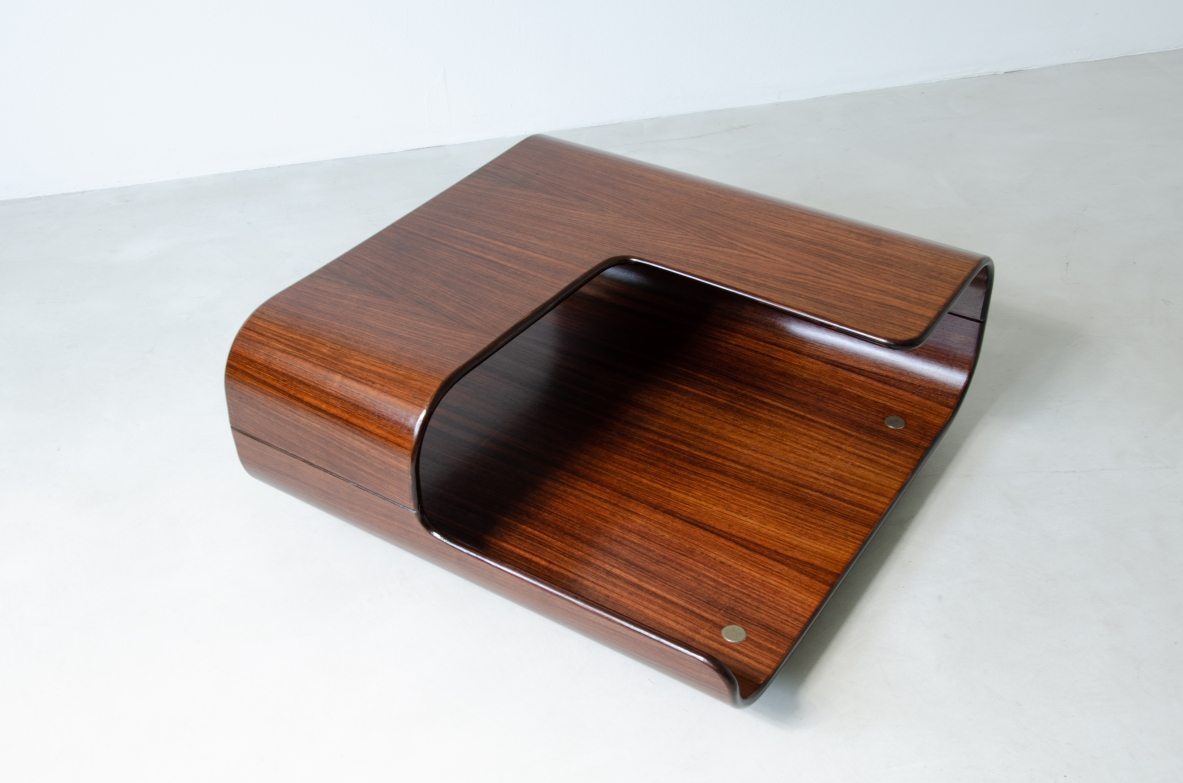 Coffee table in curved wood with two shaped shelves.  Italian manufacture, 1960's.