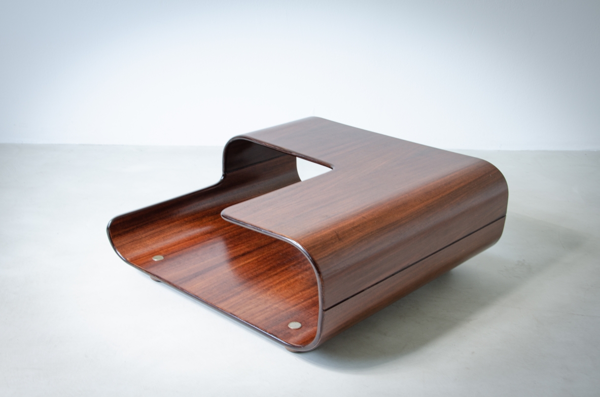 Coffee table in curved wood with two shaped shelves.  Italian manufacture, 1960's.