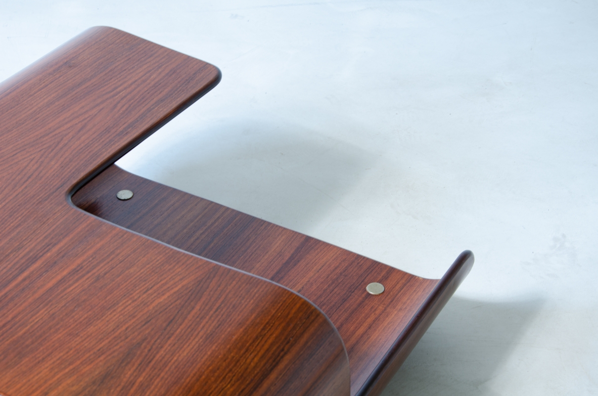 Coffee table in curved wood with two shaped shelves.  Italian manufacture, 1960's.
