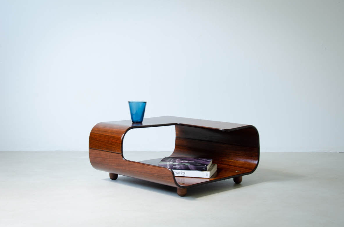Coffee table in curved wood with two shaped shelves.  Italian manufacture, 1960's.