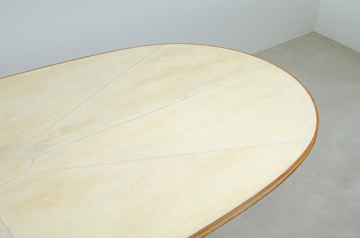 Unique large table with elegant structure in maple wood and top covered with goat skin.  Italian 1950s manufacture.
