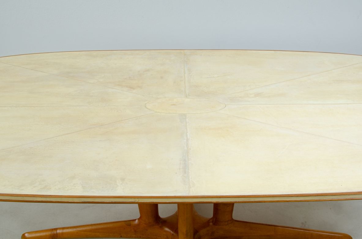 Unique large table with elegant structure in maple wood and top covered with goat skin.  Italian 1950s manufacture.