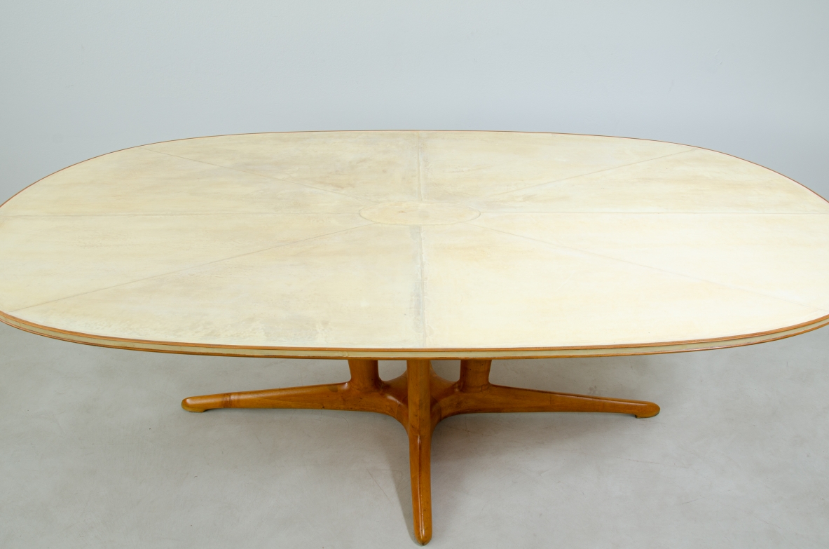 Unique large table with elegant structure in maple wood and top covered with goat skin.  Italian 1950s manufacture.