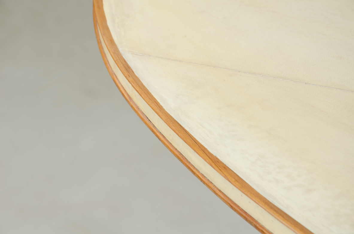 Unique large table with elegant structure in maple wood and top covered with goat skin.  Italian 1950s manufacture.