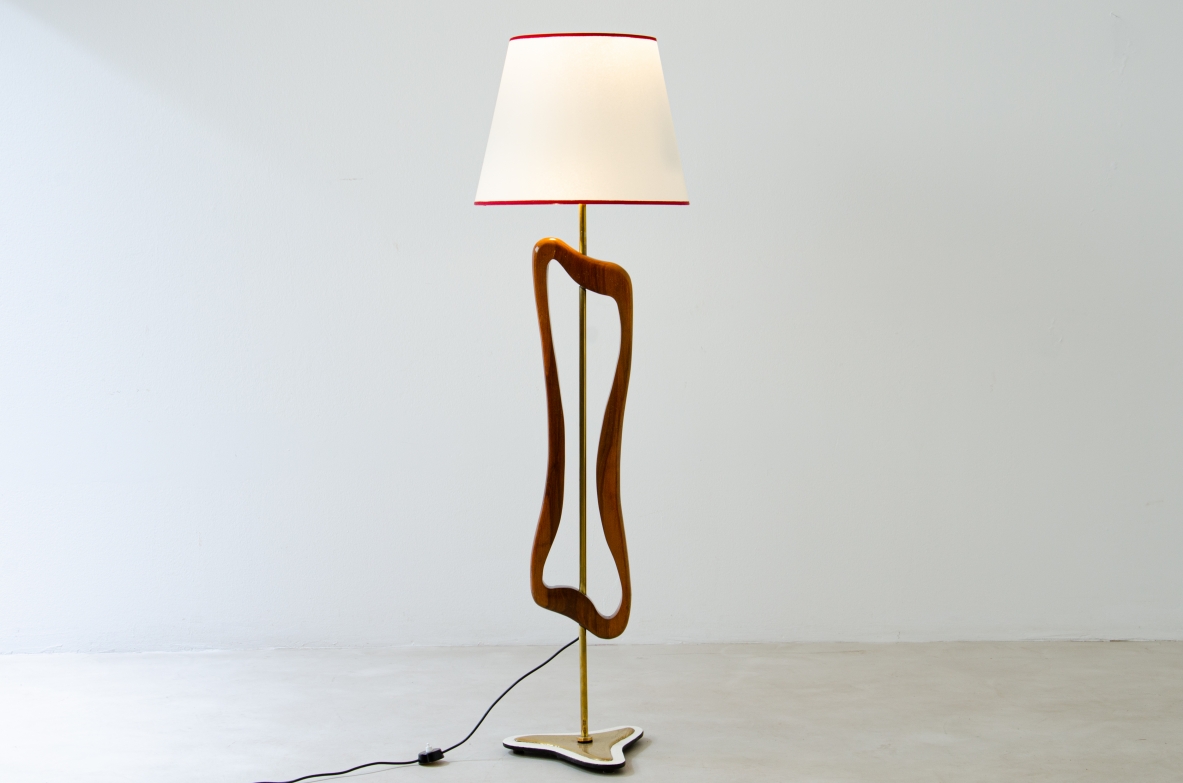 Unique three-light sculptural floor lamp in brass and shaped wood with parchment shade. Italian manufacture, 1950's.