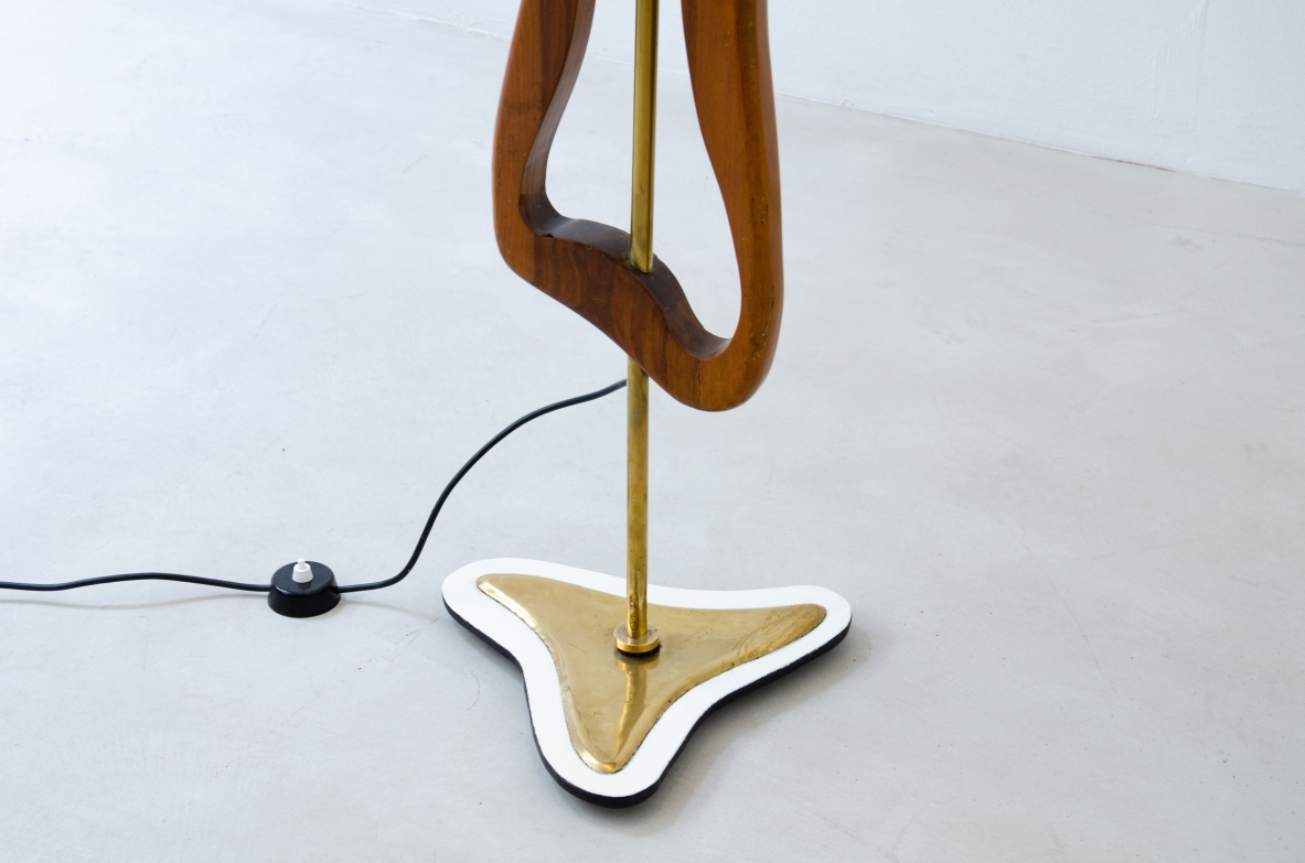 Unique three-light sculptural floor lamp in brass and shaped wood with parchment shade. Italian manufacture, 1950's.