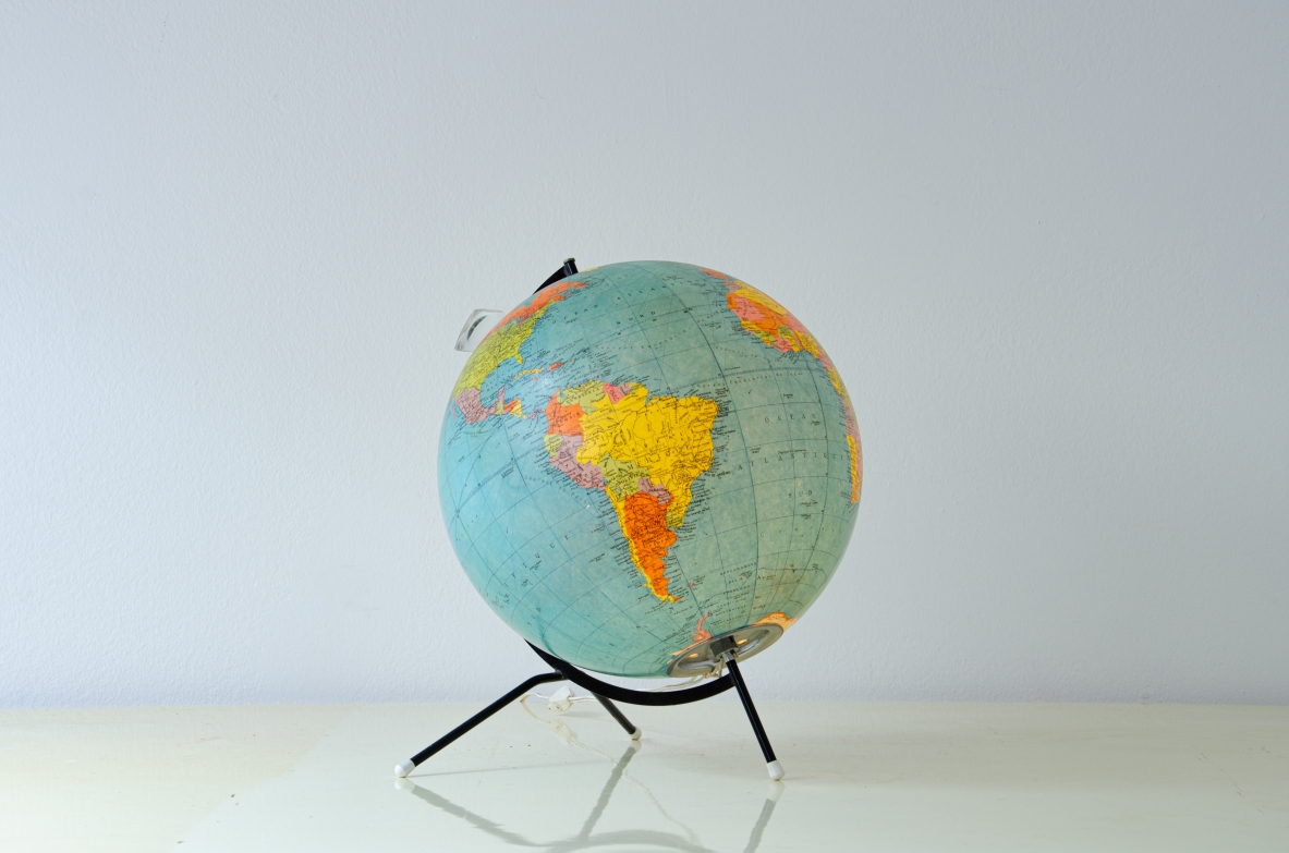 Table globe with glass sphere illuminated inside and with adjustable lens. Cartes Taride, Paris, 1950's.