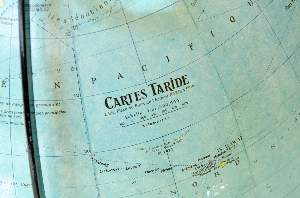 Table globe with glass sphere illuminated inside and with adjustable lens. Cartes Taride, Paris, 1950's.