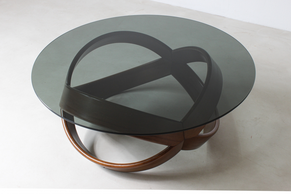 Low table with curved wooden base. Italian manufacture, 1970's.