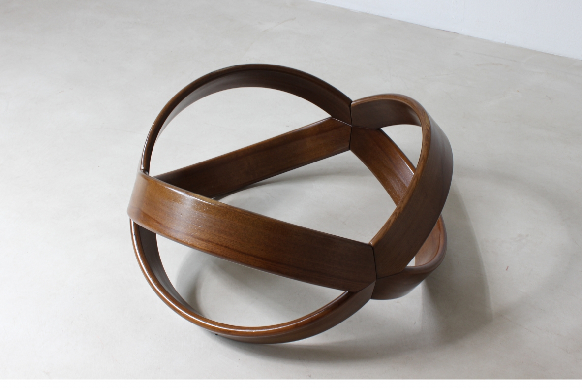 Low table with curved wooden base. Italian manufacture, 1970's.