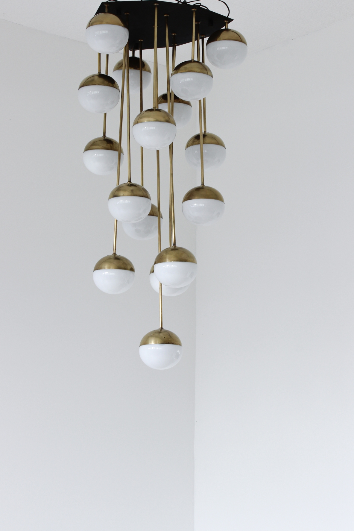 Large 18-light chandelier with brass structure and opaline glasses. Stilnovo production, 1960's.