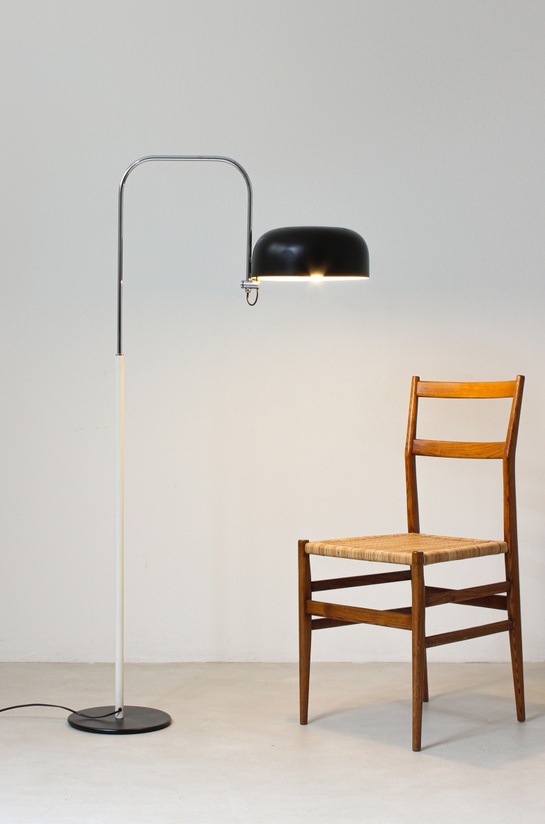 Reading lamp in black and white lacquered metal with curved chromed metal stem.  Italian 60s manufacture.