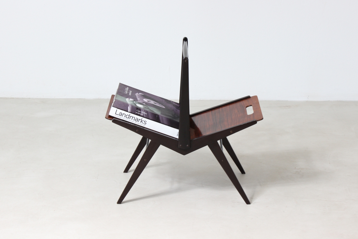 Elegant magazine rack in dark wood.  Italian manufacture, 1950's.